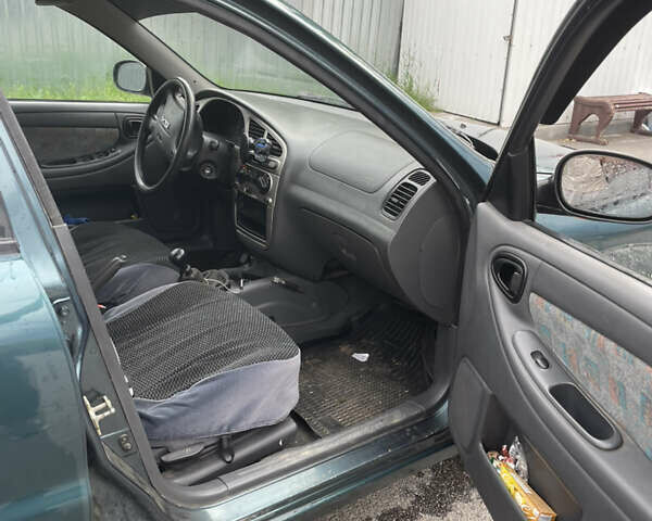 Зеленый Дэу Ланос, объемом двигателя 1.6 л и пробегом 233 тыс. км за 1900 $, фото 5 на Automoto.ua