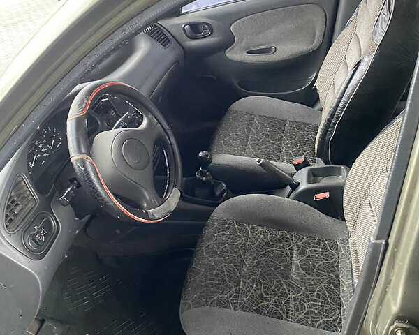 Зеленый Дэу Ланос, объемом двигателя 1.6 л и пробегом 202 тыс. км за 1500 $, фото 6 на Automoto.ua