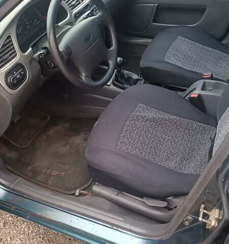 Зеленый Дэу Ланос, объемом двигателя 1.6 л и пробегом 291 тыс. км за 1999 $, фото 3 на Automoto.ua