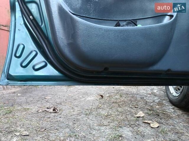 Зелений Деу Ланос, об'ємом двигуна 1.5 л та пробігом 293 тис. км за 1800 $, фото 11 на Automoto.ua