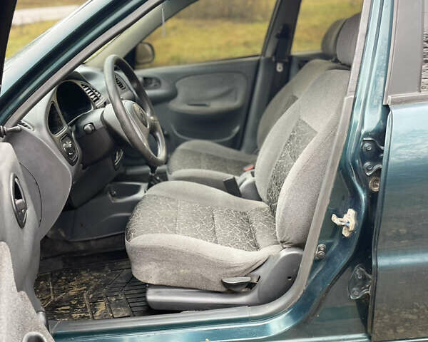 Зелений Деу Ланос, об'ємом двигуна 1.35 л та пробігом 256 тис. км за 1499 $, фото 13 на Automoto.ua