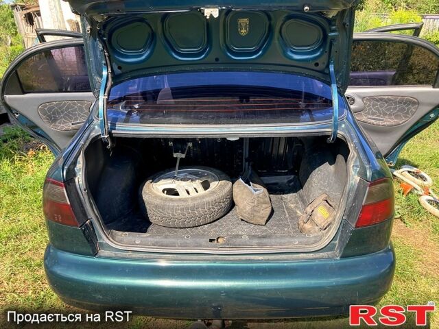 Зеленый Дэу Ланос, объемом двигателя 1.5 л и пробегом 290 тыс. км за 1000 $, фото 3 на Automoto.ua