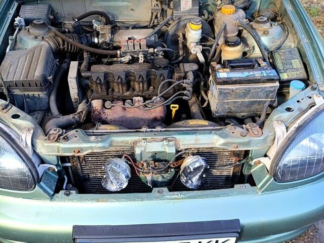 Зеленый Дэу Ланос, объемом двигателя 1.5 л и пробегом 184 тыс. км за 1900 $, фото 7 на Automoto.ua