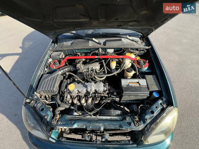Зелений Деу Ланос, об'ємом двигуна 2 л та пробігом 245 тис. км за 2300 $, фото 30 на Automoto.ua