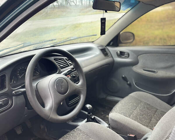 Зелений Деу Ланос, об'ємом двигуна 1.35 л та пробігом 256 тис. км за 1499 $, фото 12 на Automoto.ua