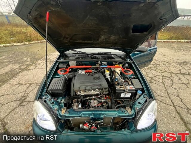 Зеленый Дэу Ланос, объемом двигателя 1.4 л и пробегом 214 тыс. км за 1999 $, фото 13 на Automoto.ua