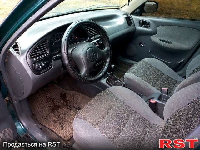Зеленый Дэу Ланос, объемом двигателя 1.5 л и пробегом 128 тыс. км за 1750 $, фото 4 на Automoto.ua