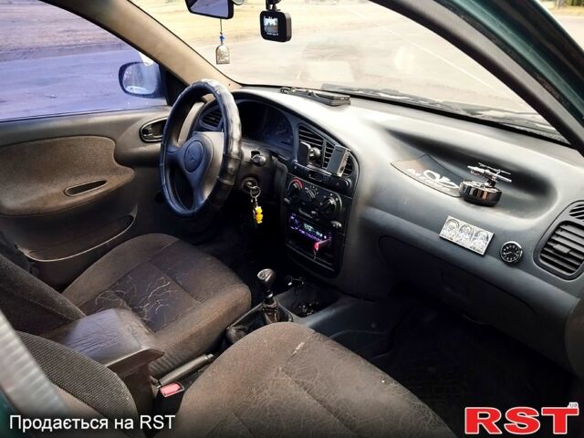 Зеленый Дэу Ланос, объемом двигателя 1.4 л и пробегом 350 тыс. км за 1300 $, фото 4 на Automoto.ua