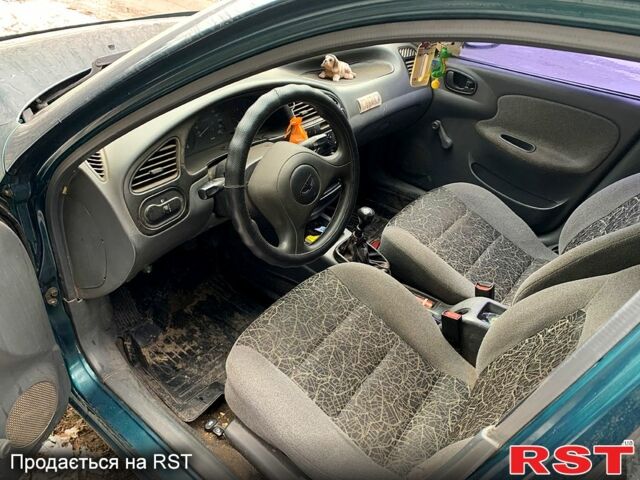 Зеленый Дэу Ланос, объемом двигателя 1.4 л и пробегом 280 тыс. км за 2000 $, фото 6 на Automoto.ua