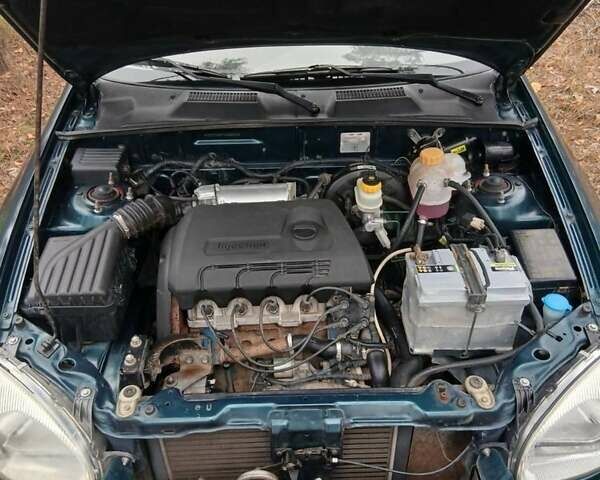 Зеленый Дэу Ланос, объемом двигателя 1.4 л и пробегом 114 тыс. км за 2200 $, фото 4 на Automoto.ua