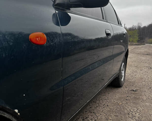 Зеленый Дэу Ланос, объемом двигателя 1.5 л и пробегом 251 тыс. км за 2800 $, фото 8 на Automoto.ua