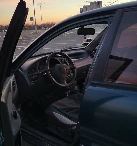 Зеленый Дэу Ланос, объемом двигателя 1.39 л и пробегом 198 тыс. км за 1999 $, фото 8 на Automoto.ua