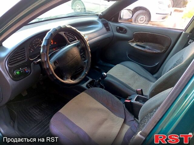 Зелений Деу Ланос, об'ємом двигуна 1.4 л та пробігом 180 тис. км за 2000 $, фото 4 на Automoto.ua