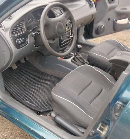 Зеленый Дэу Ланос, объемом двигателя 1.6 л и пробегом 150 тыс. км за 1500 $, фото 4 на Automoto.ua