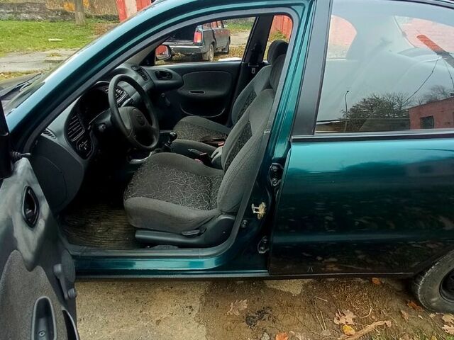 Зеленый Дэу Ланос, объемом двигателя 1.5 л и пробегом 230 тыс. км за 2250 $, фото 4 на Automoto.ua