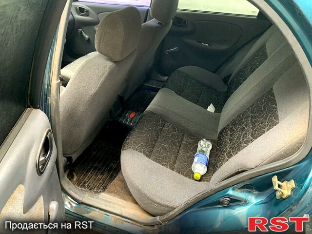 Зеленый Дэу Ланос, объемом двигателя 1.4 л и пробегом 280 тыс. км за 2000 $, фото 8 на Automoto.ua