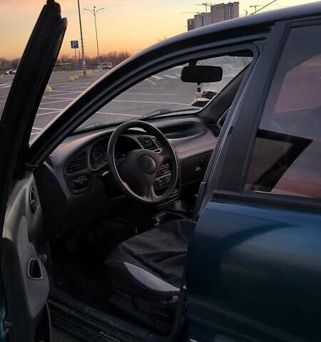 Зеленый Дэу Ланос, объемом двигателя 1.39 л и пробегом 198 тыс. км за 1999 $, фото 3 на Automoto.ua