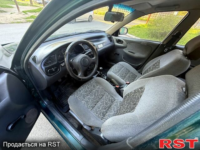 Зеленый Дэу Ланос, объемом двигателя 1.5 л и пробегом 200 тыс. км за 1500 $, фото 8 на Automoto.ua