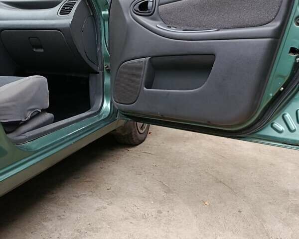 Зеленый Дэу Ланос, объемом двигателя 1.5 л и пробегом 241 тыс. км за 3000 $, фото 12 на Automoto.ua