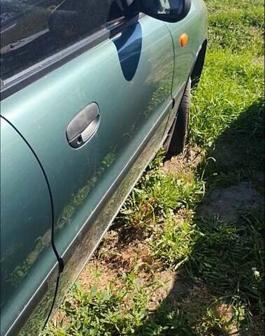 Зеленый Дэу Ланос, объемом двигателя 1.6 л и пробегом 137 тыс. км за 1500 $, фото 2 на Automoto.ua