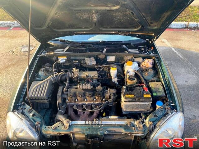 Зеленый Дэу Ланос, объемом двигателя 1.5 л и пробегом 230 тыс. км за 2200 $, фото 6 на Automoto.ua