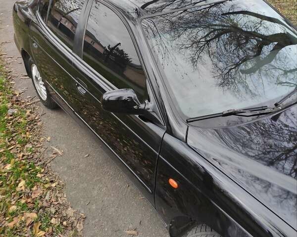 Черный Дэу Леганза, объемом двигателя 2 л и пробегом 250 тыс. км за 2100 $, фото 2 на Automoto.ua