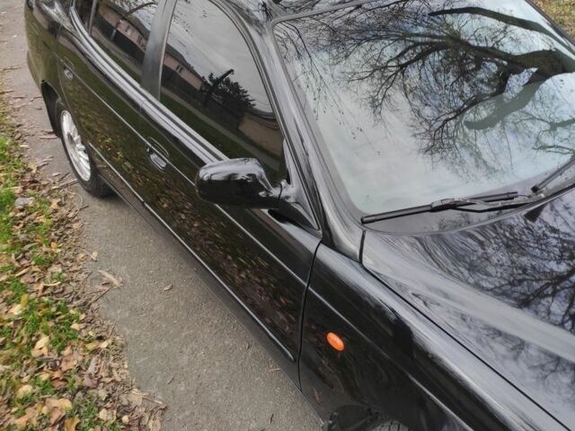 Черный Дэу Леганза, объемом двигателя 2 л и пробегом 235 тыс. км за 2100 $, фото 2 на Automoto.ua