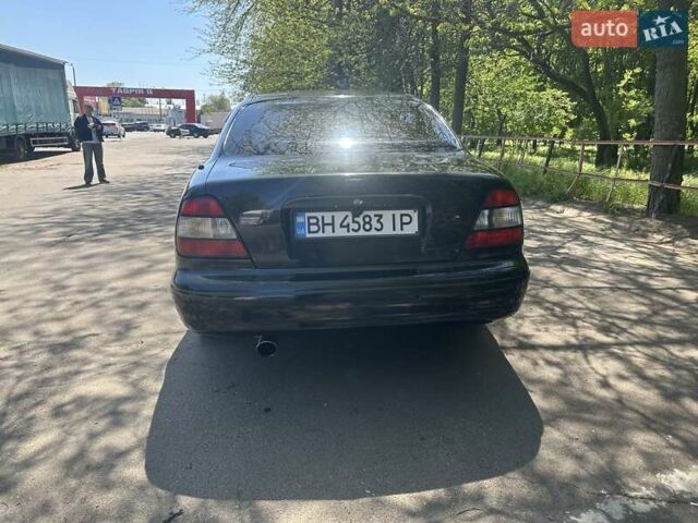 Чорний Деу Леганза, об'ємом двигуна 2 л та пробігом 316 тис. км за 2500 $, фото 4 на Automoto.ua