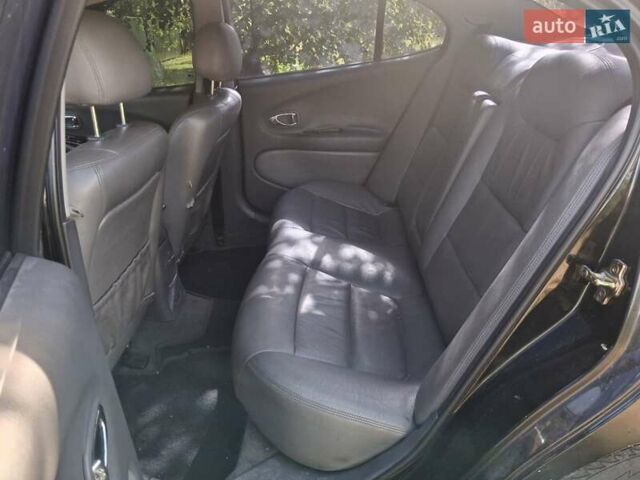 Черный Дэу Леганза, объемом двигателя 2 л и пробегом 225 тыс. км за 1700 $, фото 1 на Automoto.ua