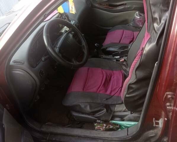 Коричневий Деу Леганза, об'ємом двигуна 2 л та пробігом 112 тис. км за 1943 $, фото 4 на Automoto.ua