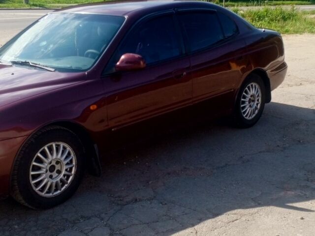 Коричневый Дэу Леганза, объемом двигателя 2 л и пробегом 270 тыс. км за 1500 $, фото 7 на Automoto.ua