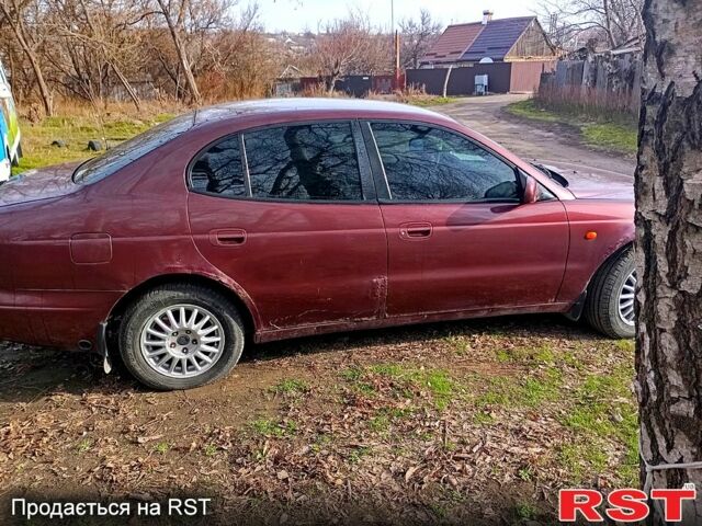 Красный Дэу Леганза, объемом двигателя 2 л и пробегом 0 тыс. км за 1000 $, фото 6 на Automoto.ua