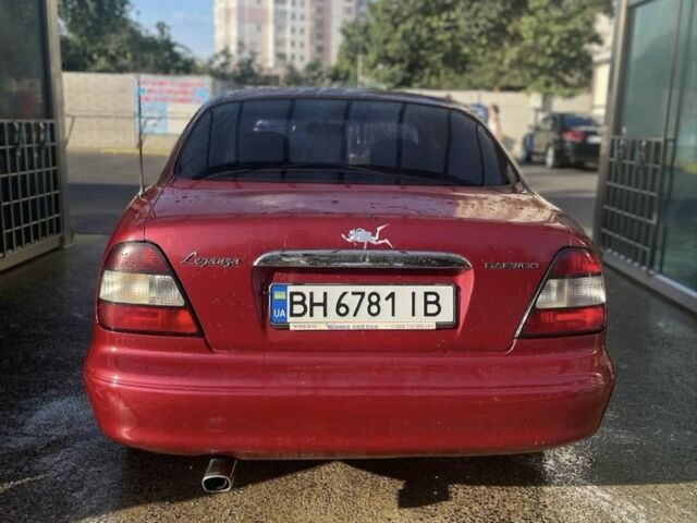 Красный Дэу Леганза, объемом двигателя 2 л и пробегом 150 тыс. км за 1100 $, фото 4 на Automoto.ua