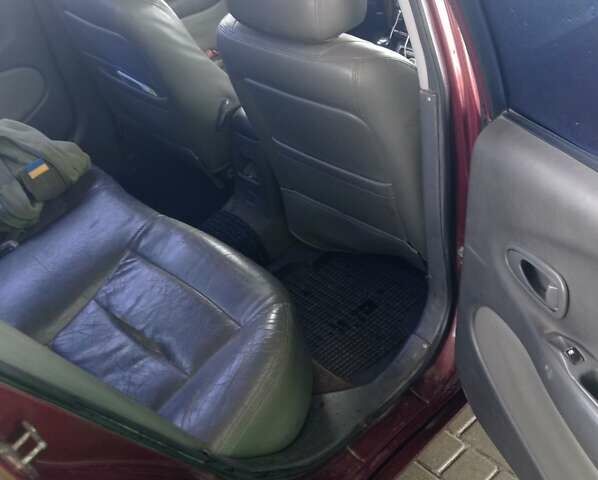 Красный Дэу Леганза, объемом двигателя 2 л и пробегом 450 тыс. км за 1185 $, фото 4 на Automoto.ua