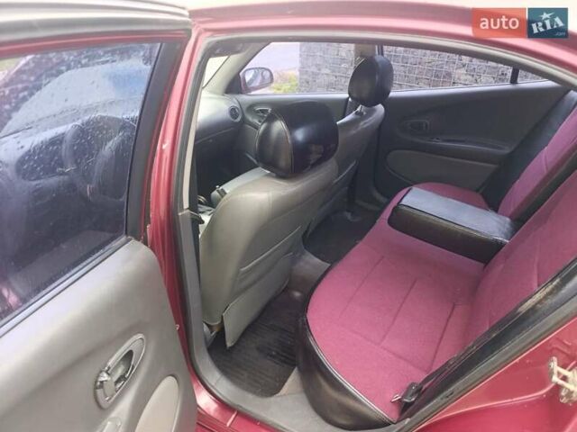 Червоний Деу Леганза, об'ємом двигуна 2 л та пробігом 285 тис. км за 1999 $, фото 1 на Automoto.ua