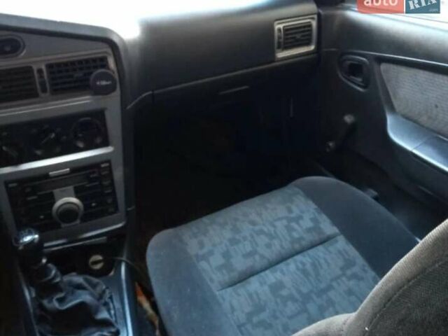 Белый Дэу Нексия, объемом двигателя 1.6 л и пробегом 325 тыс. км за 1300 $, фото 4 на Automoto.ua