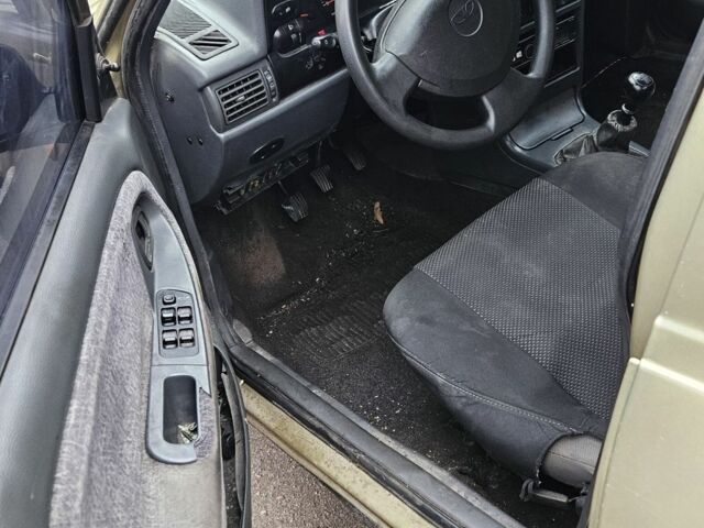 Бежевый Дэу Нексия, объемом двигателя 1.5 л и пробегом 234 тыс. км за 1150 $, фото 6 на Automoto.ua