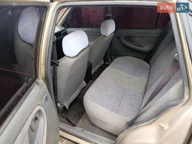 Бежевый Дэу Нексия, объемом двигателя 1.5 л и пробегом 277 тыс. км за 1000 $, фото 3 на Automoto.ua