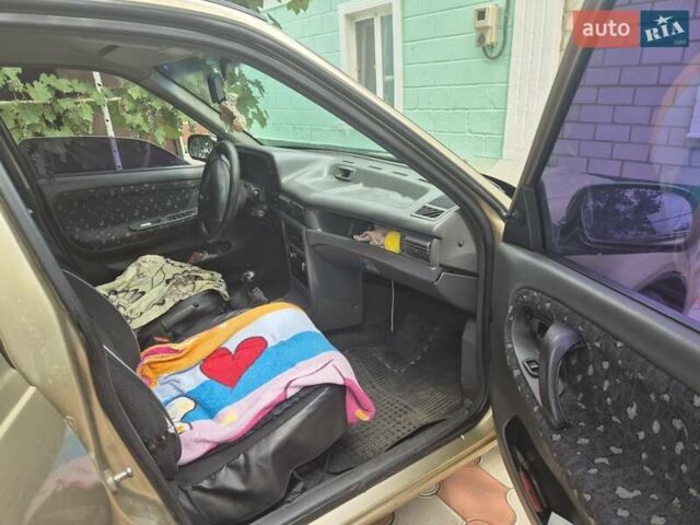 Бежевый Дэу Нексия, объемом двигателя 1.5 л и пробегом 170 тыс. км за 2300 $, фото 3 на Automoto.ua