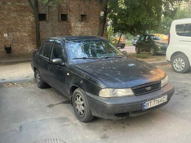 Черный Дэу Нексия, объемом двигателя 1.5 л и пробегом 200 тыс. км за 904 $, фото 1 на Automoto.ua
