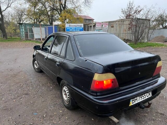 Чорний Деу Нексія, об'ємом двигуна 1.5 л та пробігом 150 тис. км за 1000 $, фото 1 на Automoto.ua