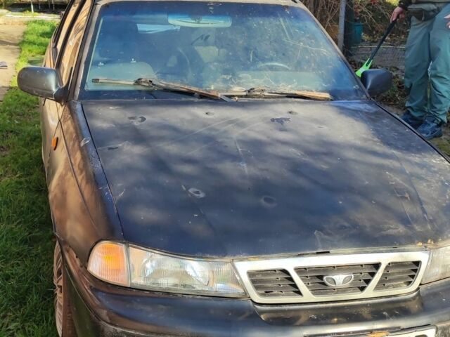 Чорний Деу Нексія, об'ємом двигуна 1.6 л та пробігом 304 тис. км за 713 $, фото 1 на Automoto.ua