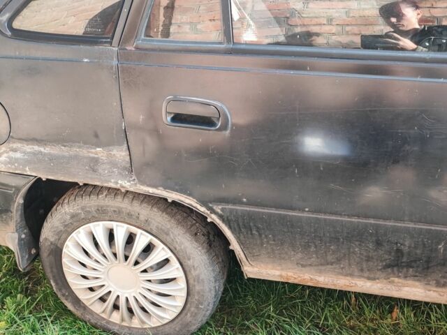 Чорний Деу Нексія, об'ємом двигуна 1.6 л та пробігом 304 тис. км за 713 $, фото 4 на Automoto.ua