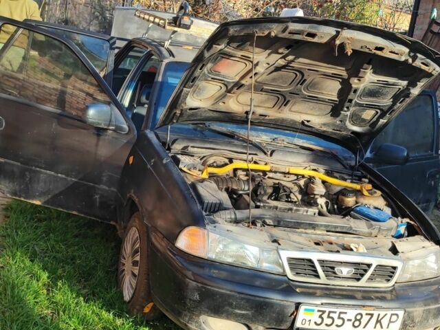 Чорний Деу Нексія, об'ємом двигуна 1.6 л та пробігом 304 тис. км за 713 $, фото 2 на Automoto.ua