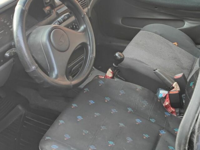 Чорний Деу Нексія, об'ємом двигуна 1.6 л та пробігом 304 тис. км за 713 $, фото 7 на Automoto.ua