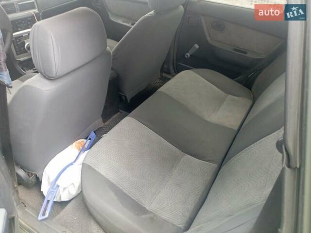 Черный Дэу Нексия, объемом двигателя 1.5 л и пробегом 467 тыс. км за 1450 $, фото 6 на Automoto.ua