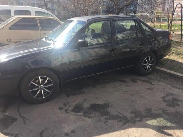 Чорний Деу Нексія, об'ємом двигуна 1.5 л та пробігом 200 тис. км за 1087 $, фото 1 на Automoto.ua