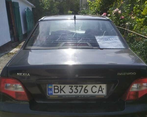 Чорний Деу Нексія, об'ємом двигуна 1.6 л та пробігом 150 тис. км за 1600 $, фото 1 на Automoto.ua