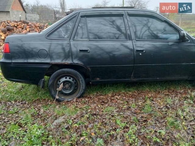 Чорний Деу Нексія, об'ємом двигуна 1.6 л та пробігом 378 тис. км за 1400 $, фото 3 на Automoto.ua