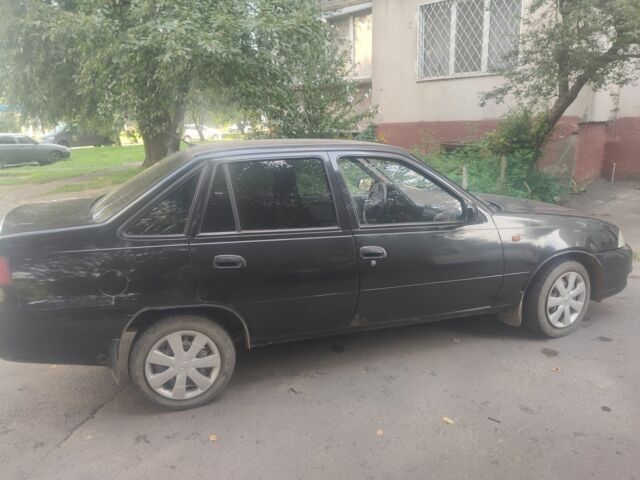 Черный Дэу Нексия, объемом двигателя 1.6 л и пробегом 237 тыс. км за 1300 $, фото 3 на Automoto.ua